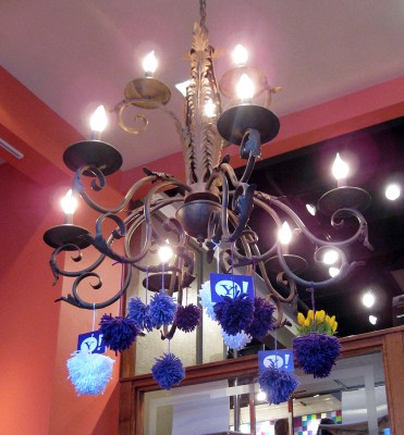 chandelier with Yahoo yarn bomb pom poms